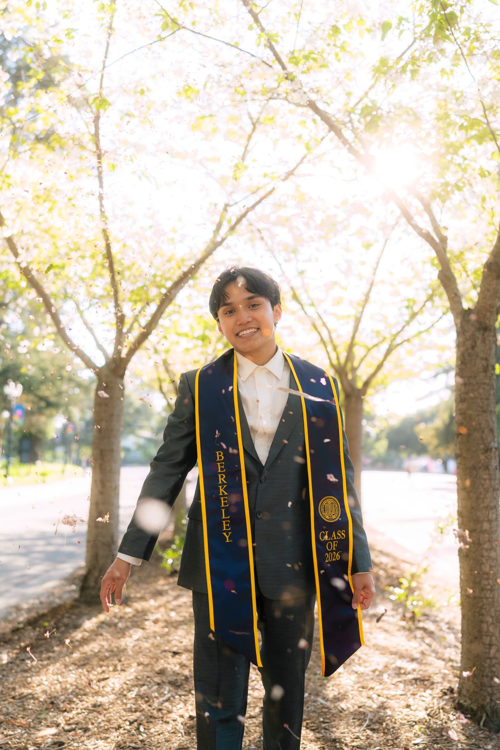 Deejay in graduation regalia on the UC Berkeley campus